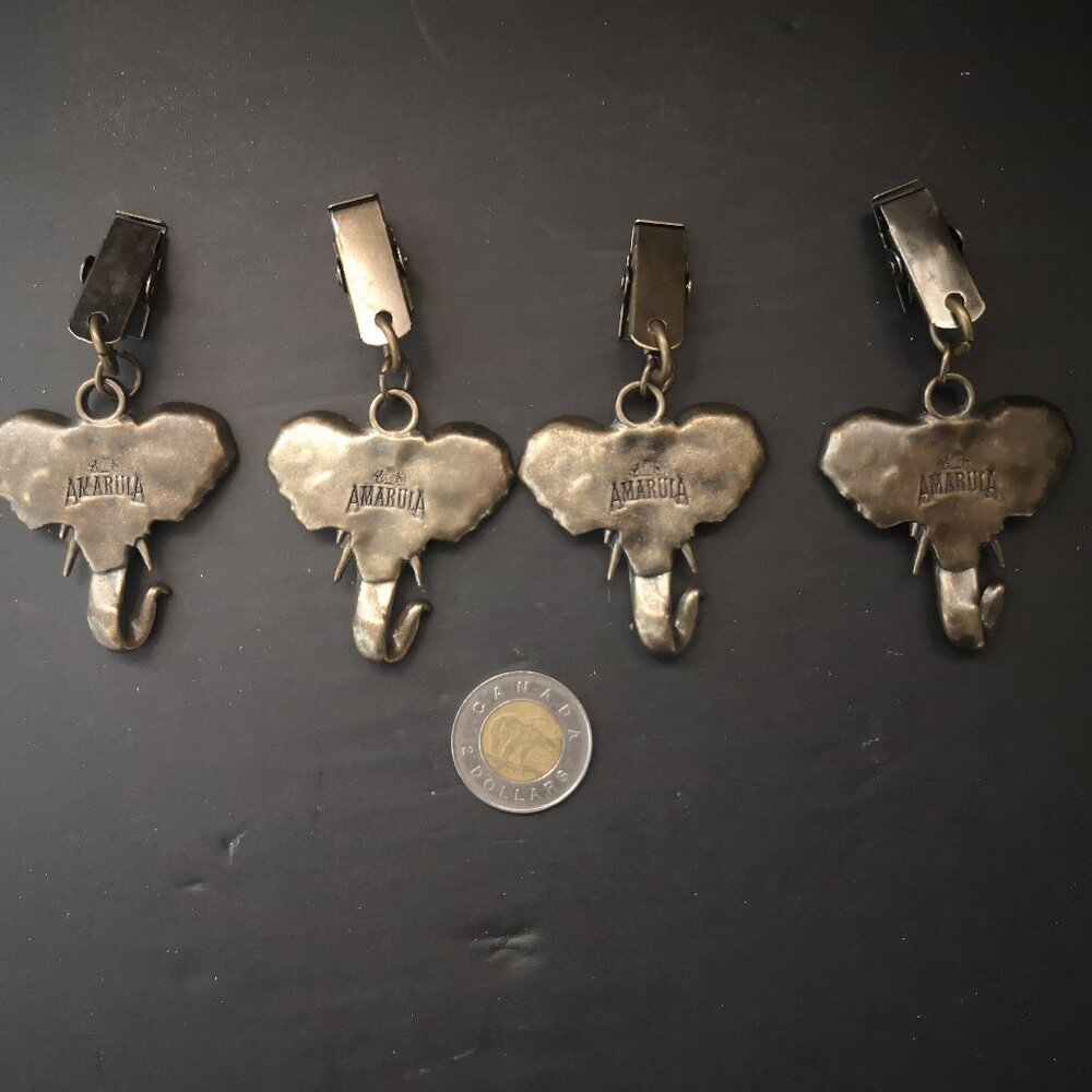 Set of 4 Amarula Cream Elephant Head Shaped Hanging Metal Tablecloth Weights - Picture 3 of 3